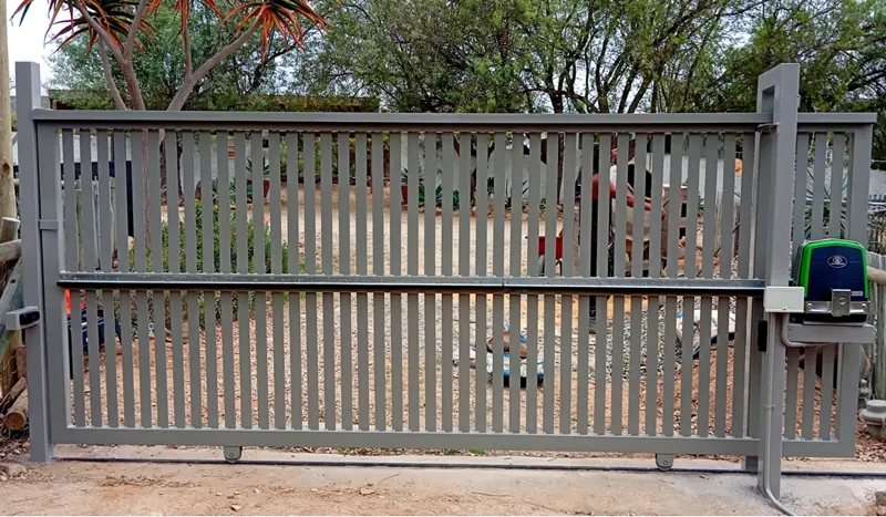 Grey slatted sliding gate with a Centurion D5 motor